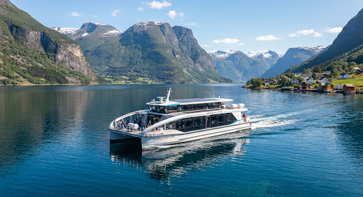 Sleek passenger catamaran on deep blue fjord water